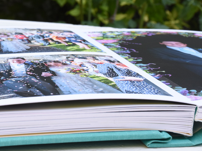 A lay-flat album. Opens out flat. Thick card pages like a traditional album.